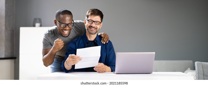 Happy Gay Couple Reading Letter Or Mail