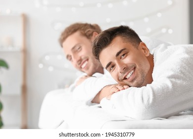 Happy Gay Couple Relaxing In Spa Salon