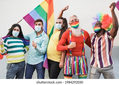 Happy Gay Men Dancing At Gay Pride Parade While Wearing Protective Face Mask For Coronavirus - Homosexual And Transgender Concept - LGBTQIA