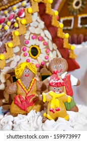 Happy Gingerbread Family Gathered By The House As Christmas Fun Decoration