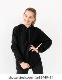 Happy Girl In Black Hoodie Smiling Wide