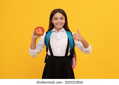 Happy Girl Child Give Thumbs Up Holding Apple And School Bag Yellow Background, Education