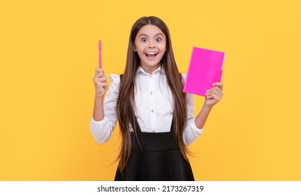 Happy Girl Child Got Idea Holding Book And Pointing Pen Up Yellow Background, Eureka