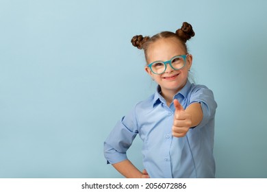 Happy girl with Down syndrome having fun and laughing in the studio - Shutterstock ID 2056072886