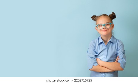 Happy girl with Down syndrome having fun and laughing in the studio. Banner - Shutterstock ID 2202715725