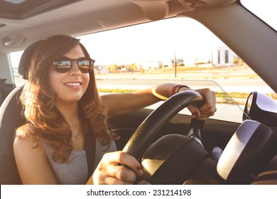 Happy Girl driving at sunset. Picture with filters and vintage effects - Shutterstock ID 231214198