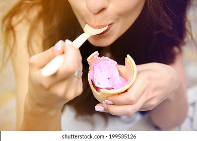 Happy girl eating ice cream.