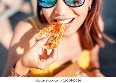 Happy Girl Eating Mexican Fast Food Quesadilla On The Beach. Healthy And Tasty Snack