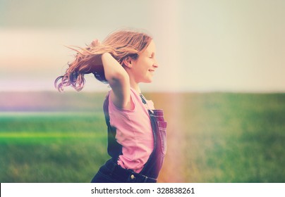 happy girl in field, with creative light leak