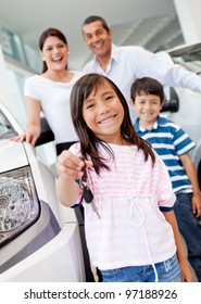 Happy Girl Holding Keys To New Family Car