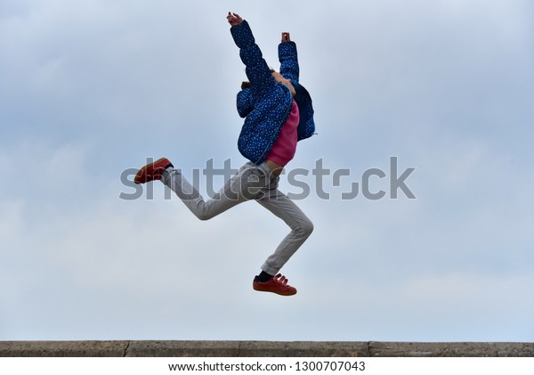 Happy Girl Jump Dance Over Floor Stock Photo Edit Now 1300707043