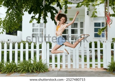 Similar – Unrecognizable women jumping over garden fence background