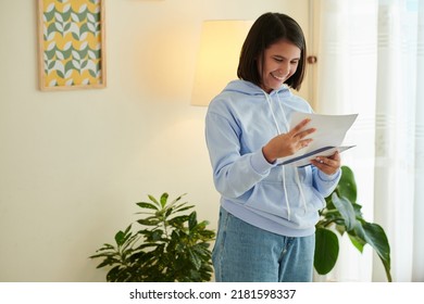 Happy Girl Laughing From Excitement Opening Letter From College