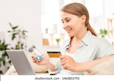 Happy Girl Looking Through Online Drugstore For Medicine