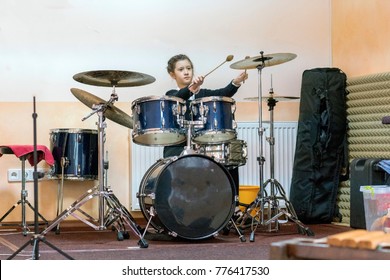 Happy Girl In Music Therapy By Playing Drum Kit On Music Room