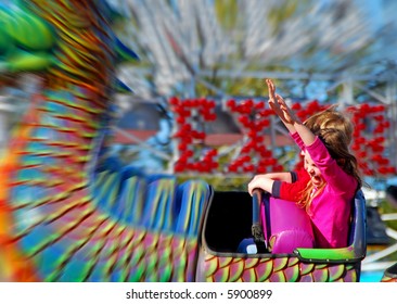 Happy Girl On Fair Rollercoaster