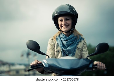Happy girl on her scooter