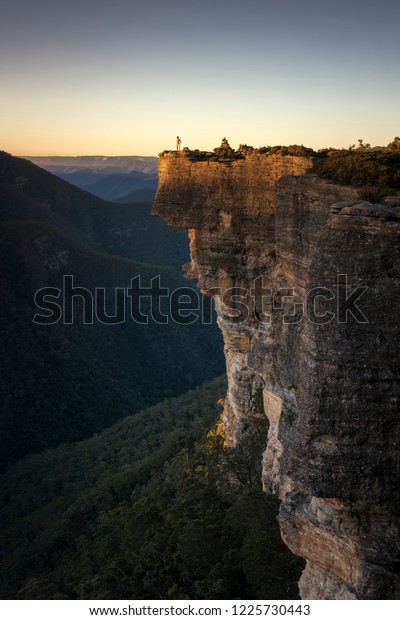 Happy girl on mountain peak, Kanangra Walls,\
Kanangra-Boyd National Park,\
Australia