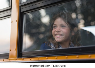 Happy Girl On School Bus Excited For First Day Of Class