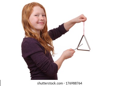 Happy Girl Playing A Triangle Instrument On White Background 