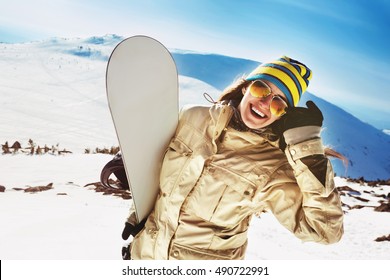 Happy Girl Snowboarder Posing In Sunglasses With Snowboard