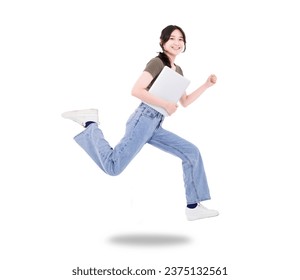 Happy girl student hold laptop jump and run wear t-shirt denim isolated white background - Powered by Shutterstock