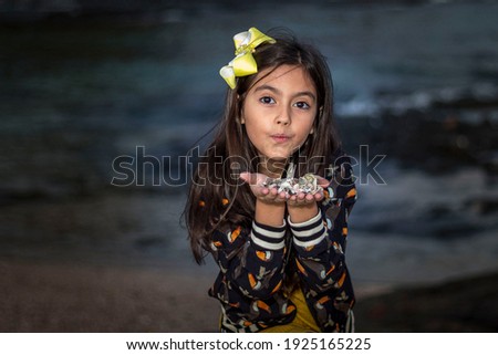 happy girl at sunset on the seashore and beach