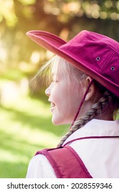 Happy Girl Wearing School Uniform, White Shirt, Maroon Backpack And Maroon Hat Back To School. Return To Classrooms After COVID-19 Outbreak In Australia