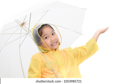 Happy girl is wearing yellow raincoat and holding white umbrella isolated on white background