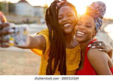 Happy girlfriends taking a selfie together outdoors
 - Powered by Shutterstock