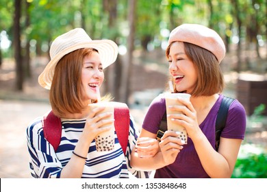 happy girls drinking bubble tea and enjoy summer vacation 