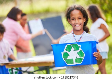 Happy girls and friends in a recycling project in the ecological summer camp - Powered by Shutterstock