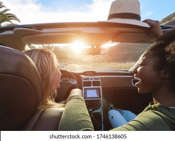 Happy Girls Having Fun In Convertible Car In Summer Vacation - Young Women Friends Laughing On Cabriolet Auto Outdoor - Main Focus On Afro Girl Eye - Travel, Holidays And Friendship Concept