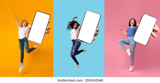 Happy glad excited international ladies jumping, fun, dancing and show phone with blank screen, isolated on colored background, panorama, collage. Positive emotions, great offer, new app and website - Shutterstock ID 2055410540