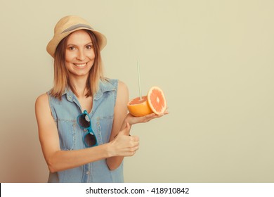 Happy Glad Woman Tourist In Straw Hat With Sunglasses And Grapefruit Citrus Fruit Giving Thumb Up. Healthy Diet Food. Summer Vacation Holidays Concept. Instagram Filtered.