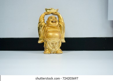 Happy golden laughing Buddha