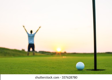 Happy Golf Player On A Golf Court At A Luxury Resort, Sunset Shot