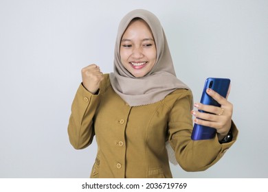 Happy Government Worker Women When Using A Smartphone. PNS Wearing Khaki Uniform.