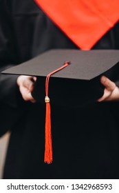 happy graduate in the gown holds a diploma of graduation - Shutterstock ID 1342968593