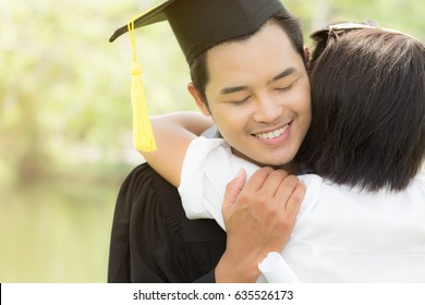 Happy Graduate Hug Celebrating With Parent Feeling So Proud And Happiness On Commencement Day,Graduation Education Success Concept