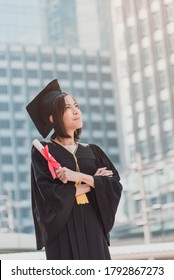 Happy Graduation Woman Education Students Hand Holding A White Diploma Over Sky Background
Young Student Graduate In Black Gown & Hold Diploma Certificate,
Commencement Day, Congratulation