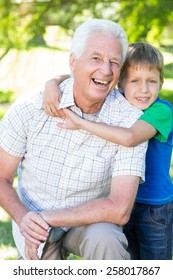 Happy Grand Father With His Grandson On A Sunny Day