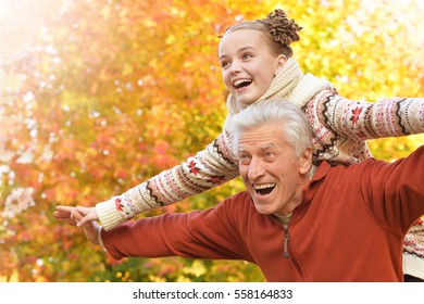 Happy grandfather and granddaughter