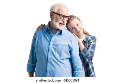 Happy Grandfather And Granddaughter Hugging Isolated On White In Studio  