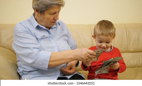 Happy Grandmother Give Money To Funny Child, Financial Education