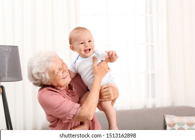 Happy grandmother with little baby at home - Powered by Shutterstock