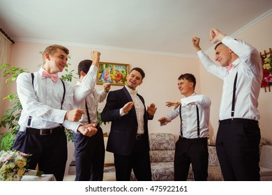 Happy Groom And Groomsmen Dance In The Hotel Room