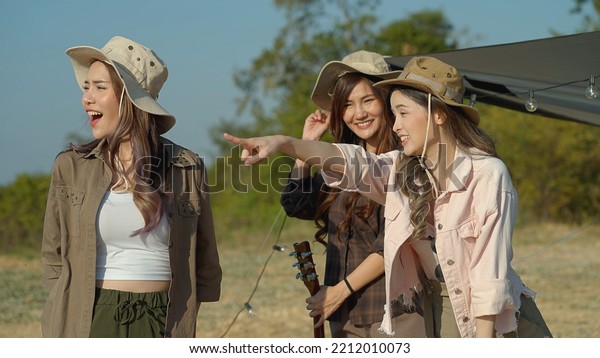 Happy group of Asian young women enjoying a camping\
trip. Video Still