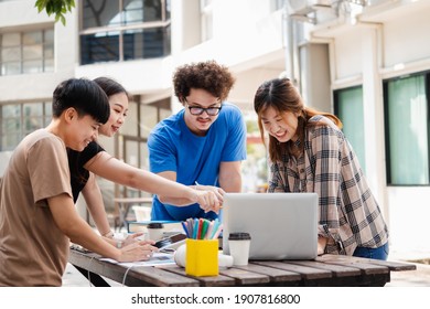 Happy Group Of Attractive Young People Using A Laptop And Tutoring Together On Study Table, Social Media Online Concept And Youth Student And Tutoring Education With Technology Learning Concept.

