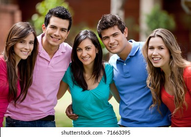 Happy group of casual friends smiling outdoors